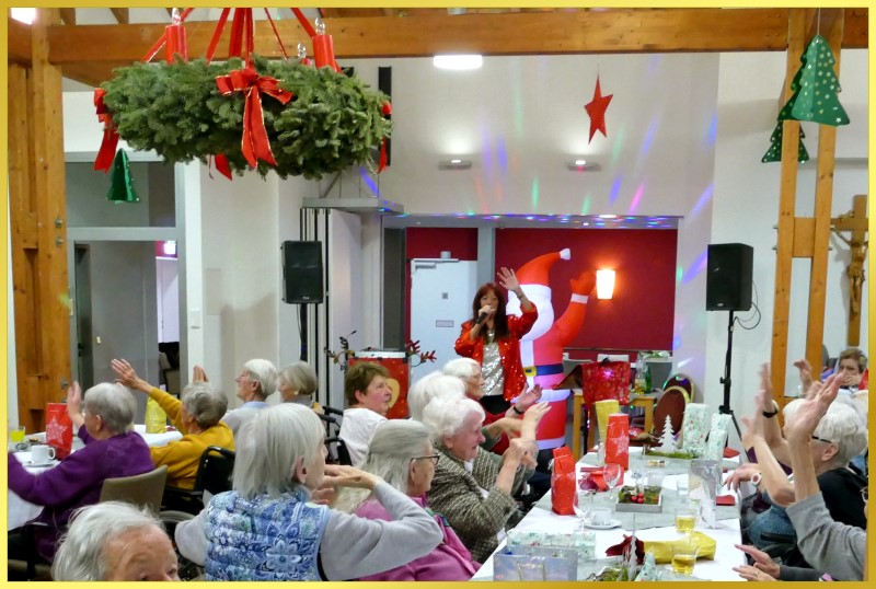 Adventsfeier mit gro�em Adventskranz.